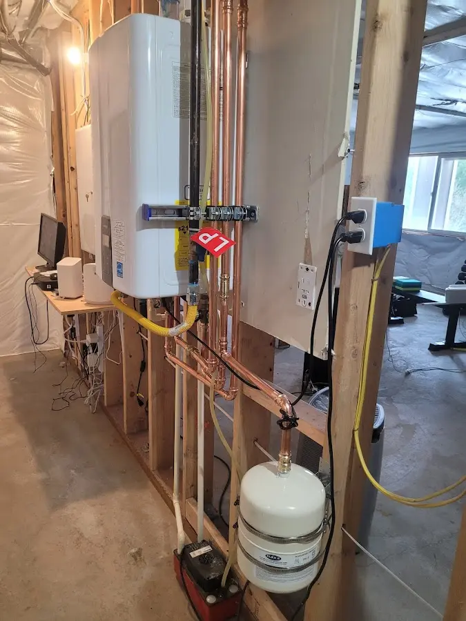 Licensed plumber repairing a kitchen sink in Pemberton